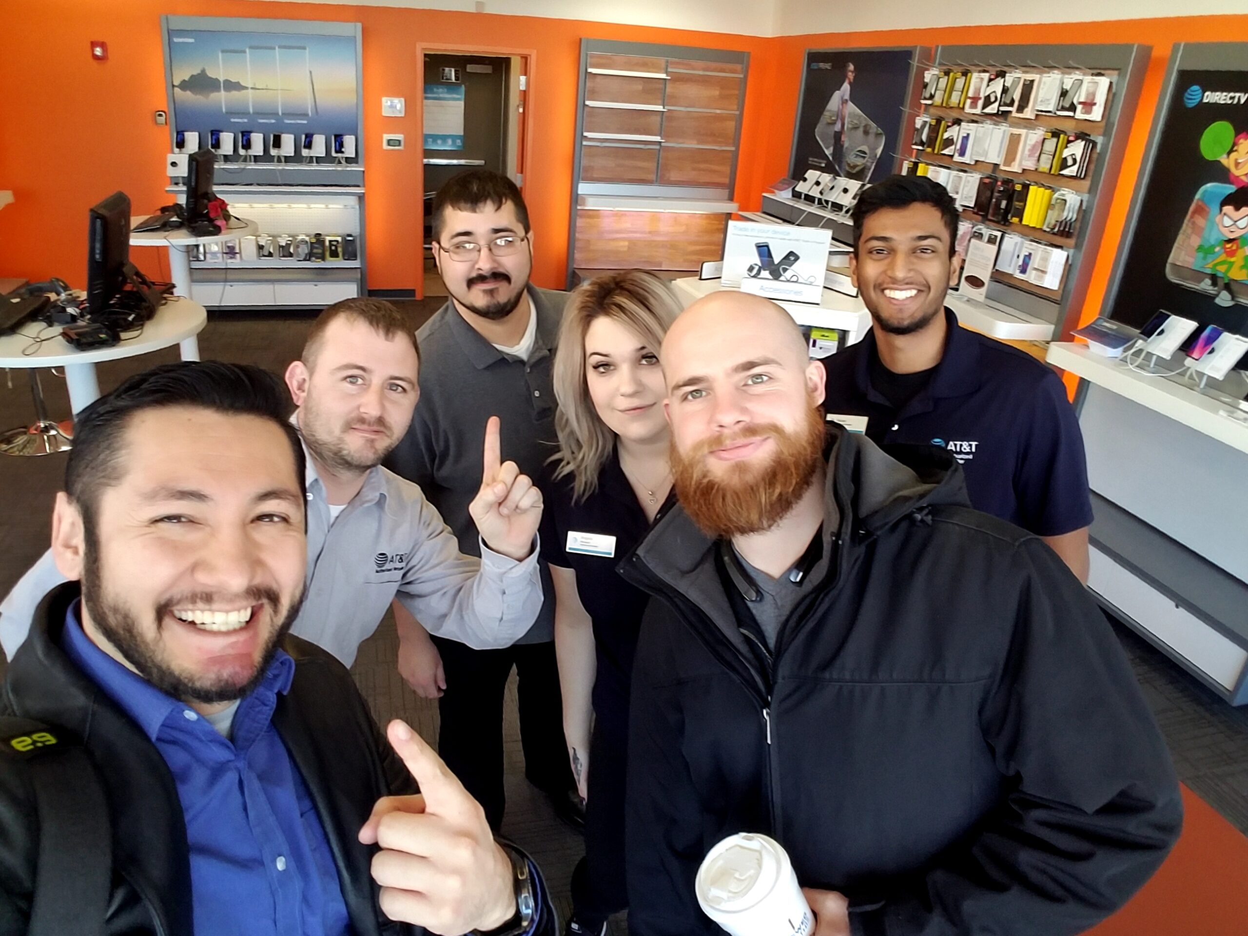 Omar Cobian with his wireless retail store team